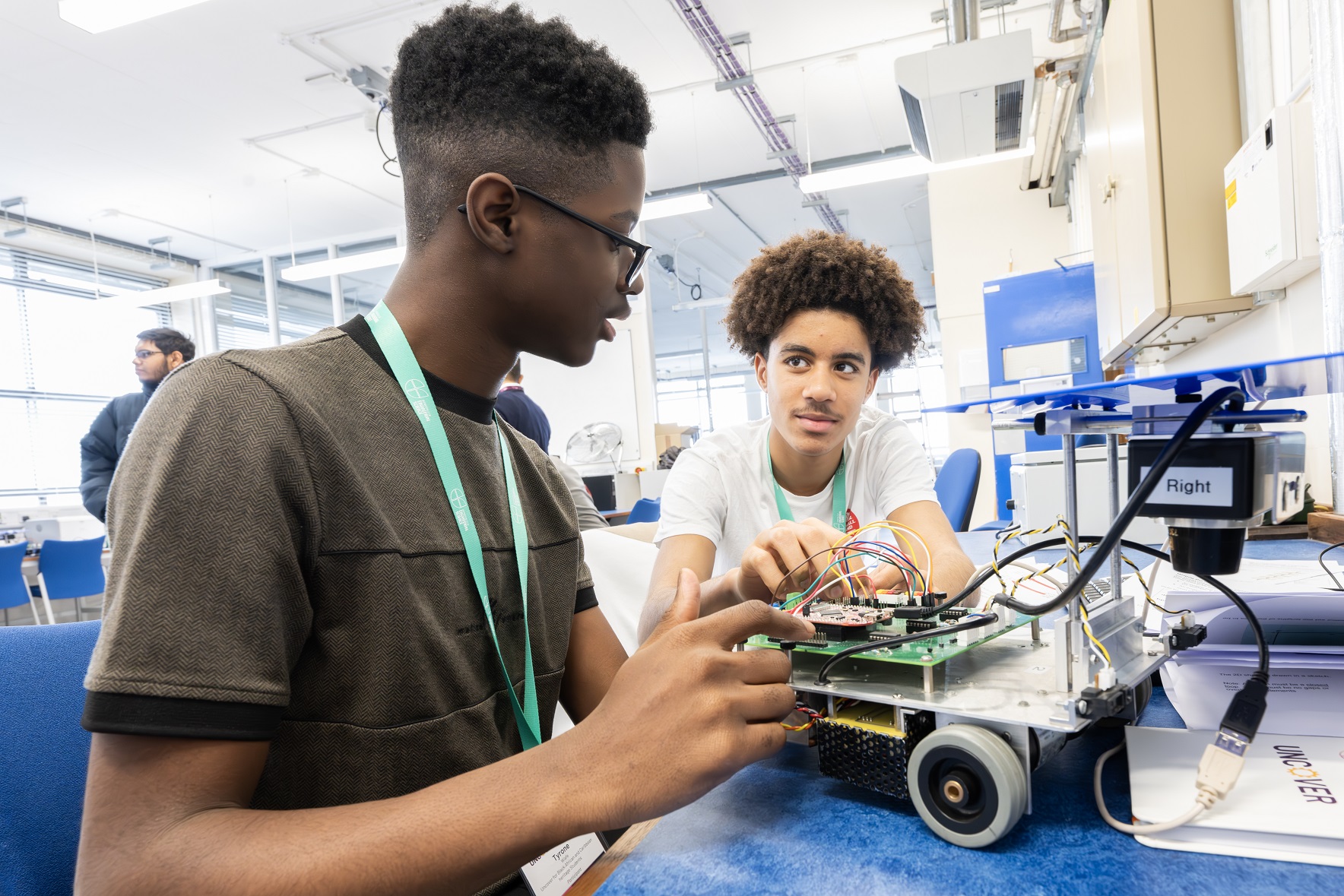 Participants of Access programme Uncover Engineering 2024 doing a Mobile Robots activity