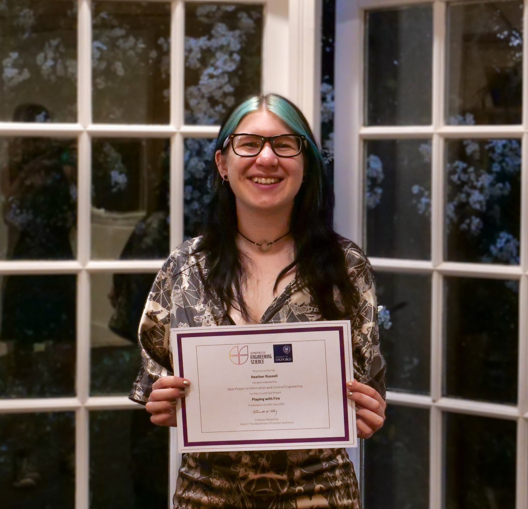 4th year student, Heather Russell (Information & Control winner) holding her certificate.