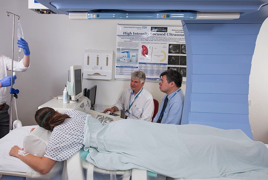 Trials of a new technique using ultrasound to remotely trigger and enhance cancer drug delivery to the tumor. Image shows medical professionals with a patient.