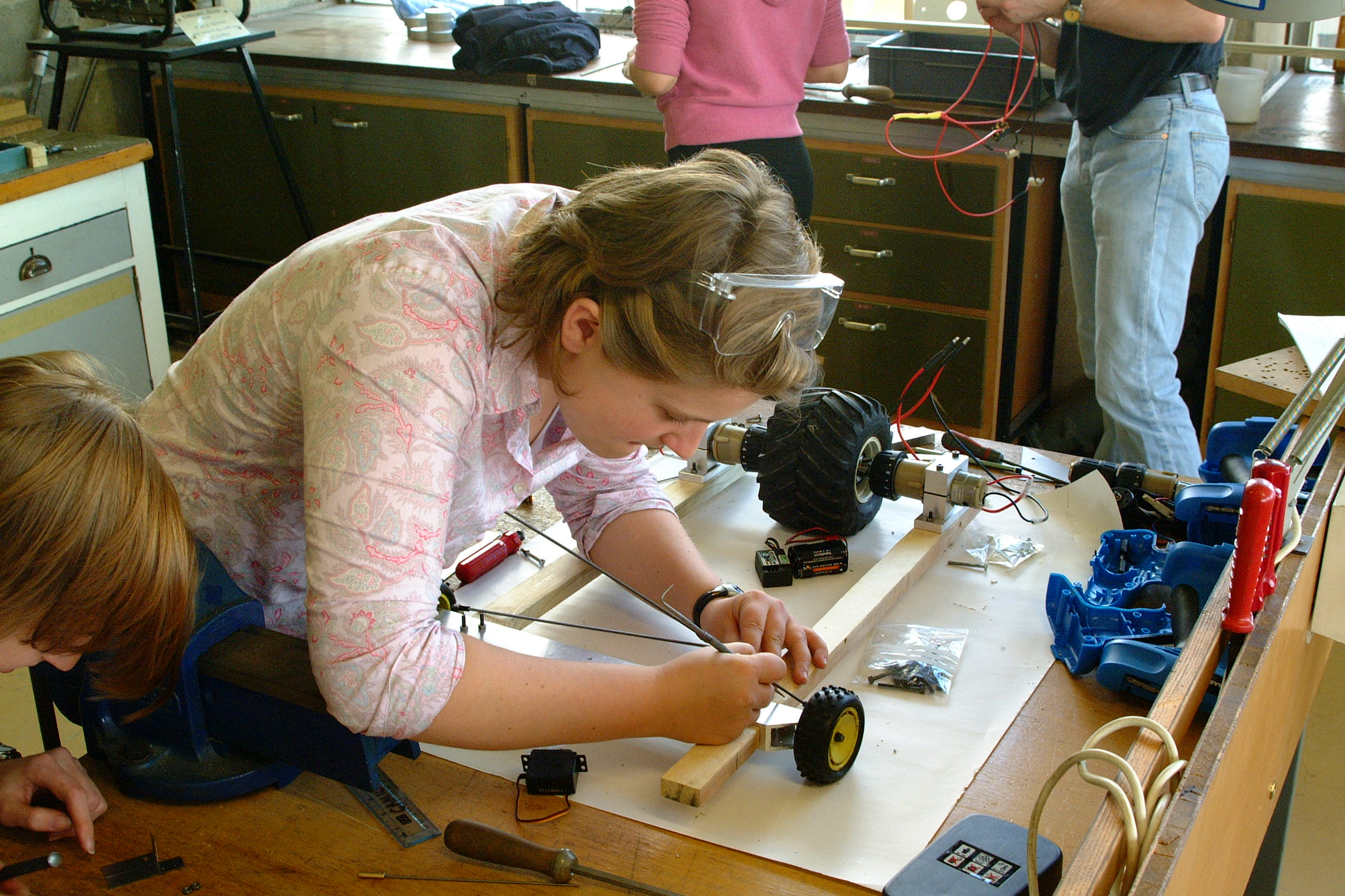 Students working on project on lab bench