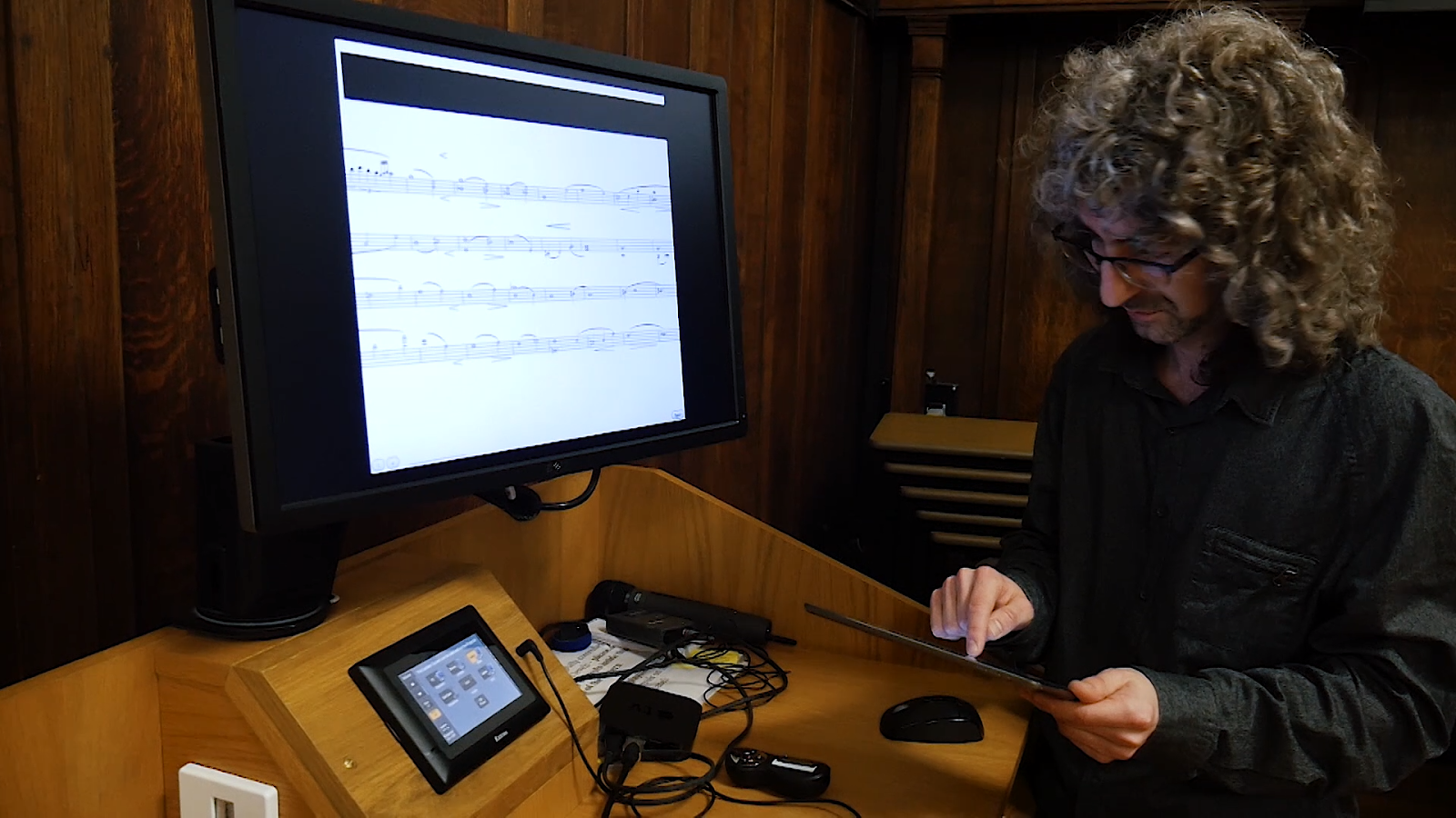 David Lewis setting up the string quartet live rehearsal annotation app for Digital Delius