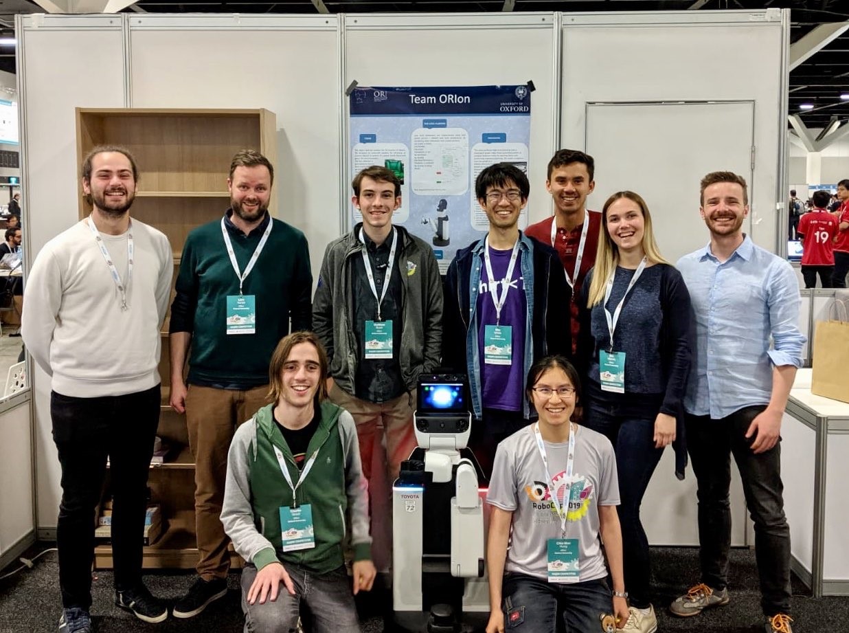 The ORIon team with their robot at the end of the 2019 Robocup competition