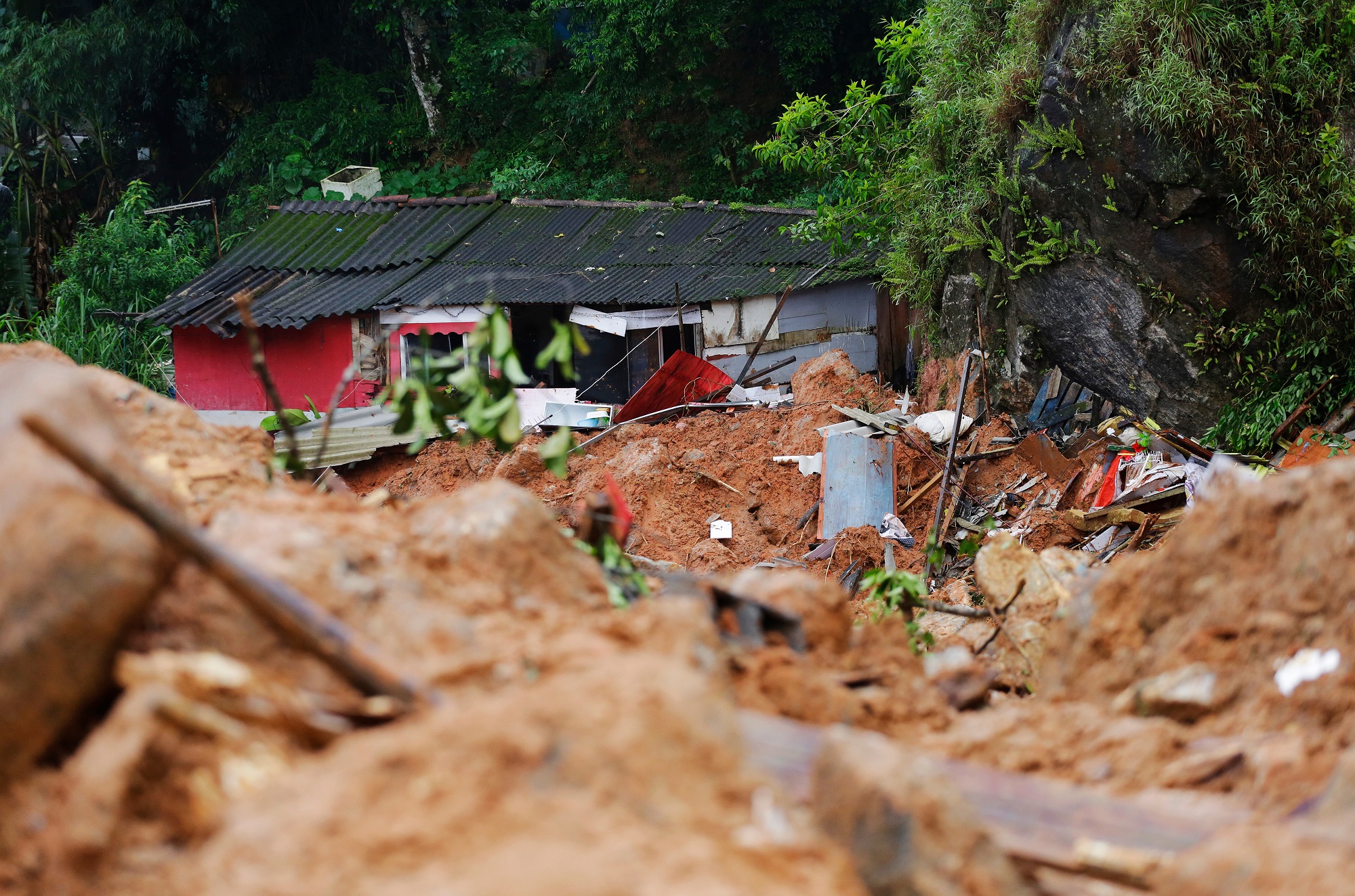 A house stands damaged by a landslide caused by heavy rains in the southeastern coast of Guarujá, São Paulo state, Brazil.