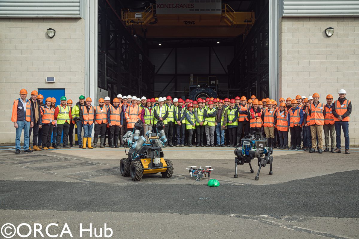 Researchers and industry representatives at the ORCA Hub demonstrations of legged robots