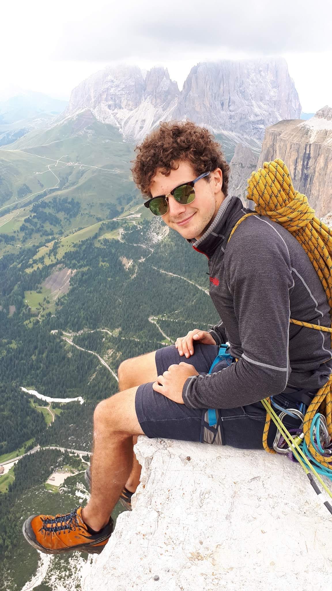 Young man smiling on mountain top