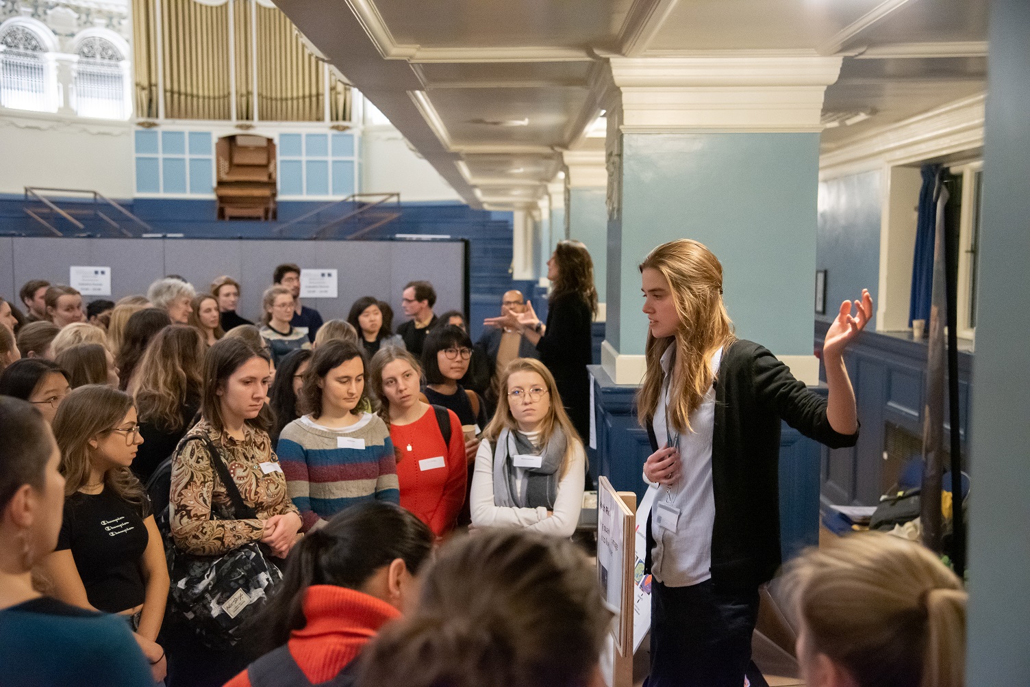 DPhil student Elisabeth Pickles talks to a room full of people at Women in STEM event at Oxford Town Hall, January 2020.