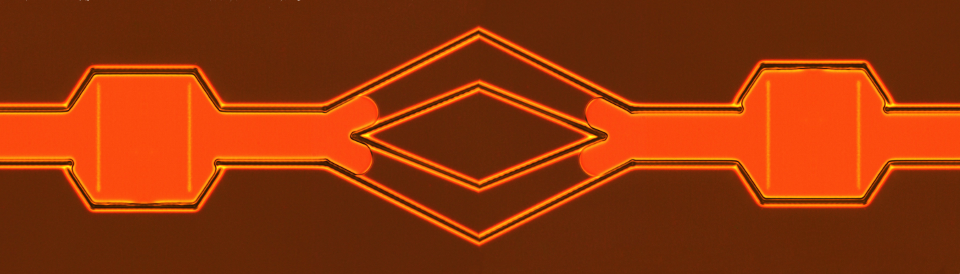 A defect confinement channel created with laser microfabrication and inspired by microfluidics 