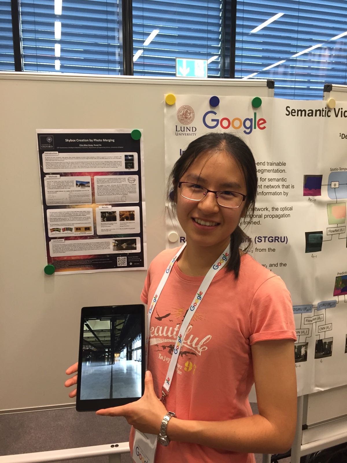 researcher showcasing her research poster at Google