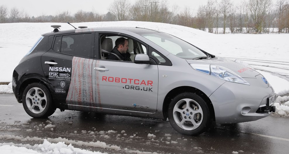 Robotcar driving on ice covered road. 