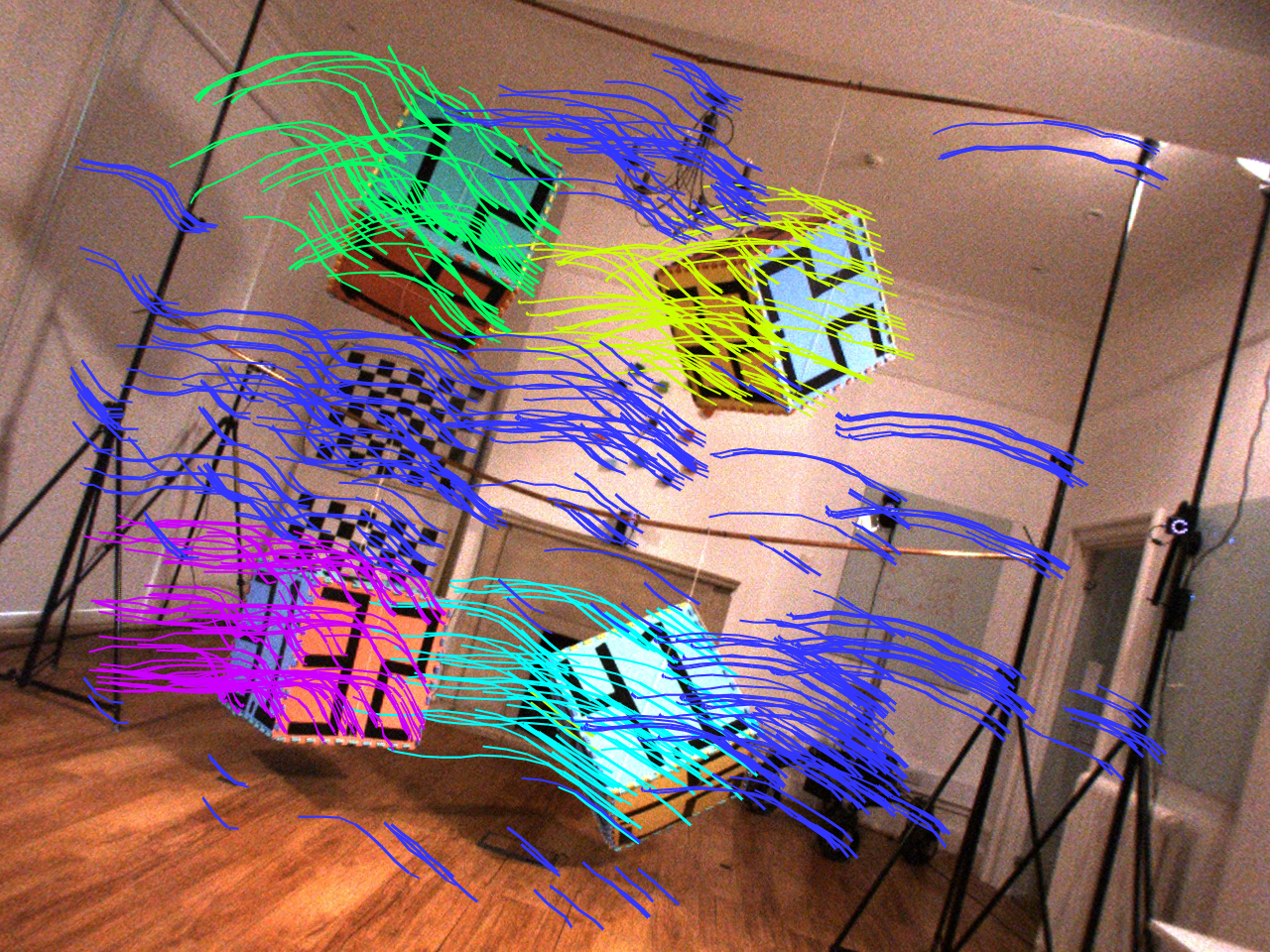 Boxes with numbers written them hanging from the ceiling, with data lines over the top