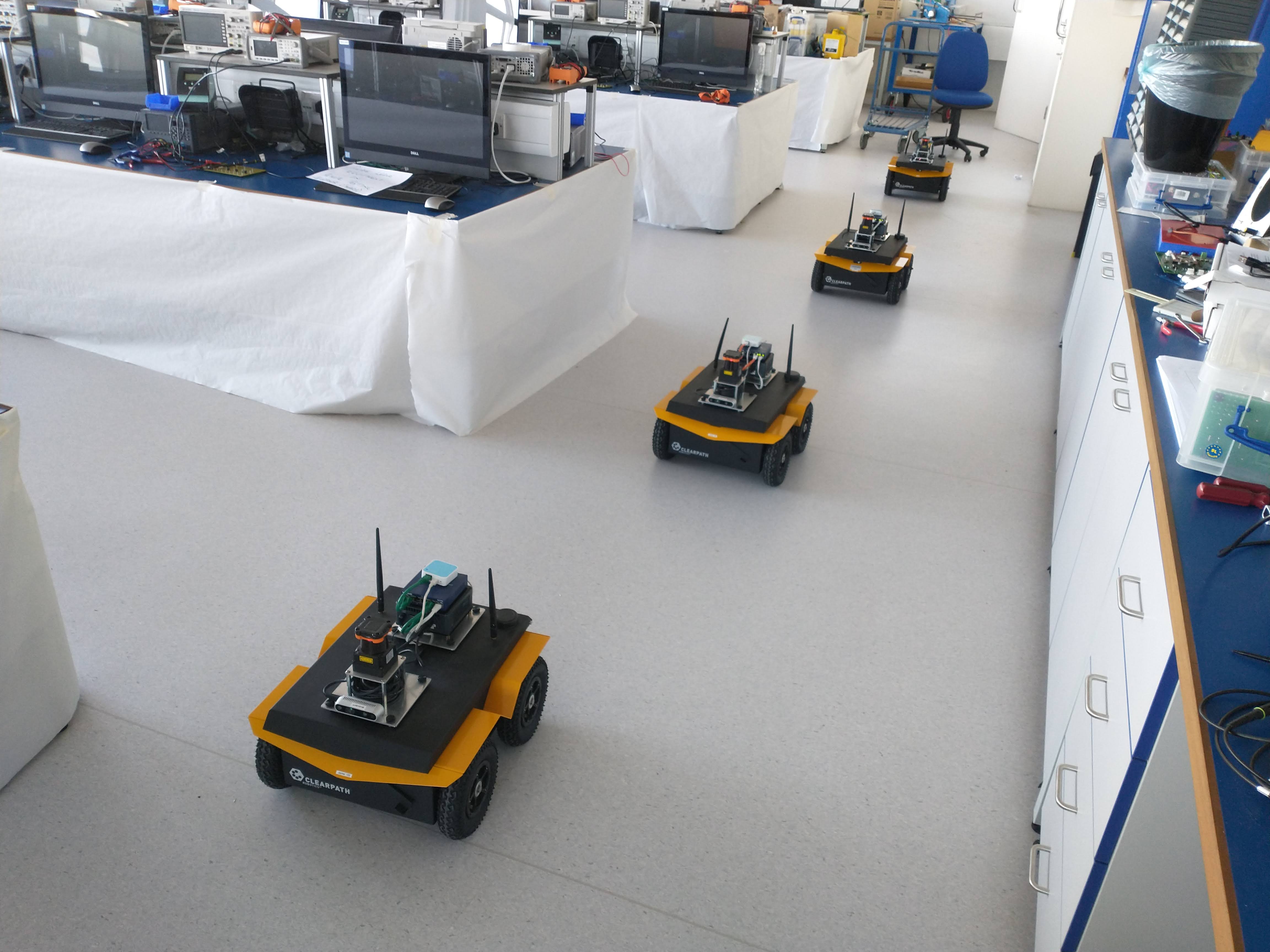 Multi-robot experiment conducted by Charlie Street as part of his research into congestion-aware robots. Jackal robot platform.  