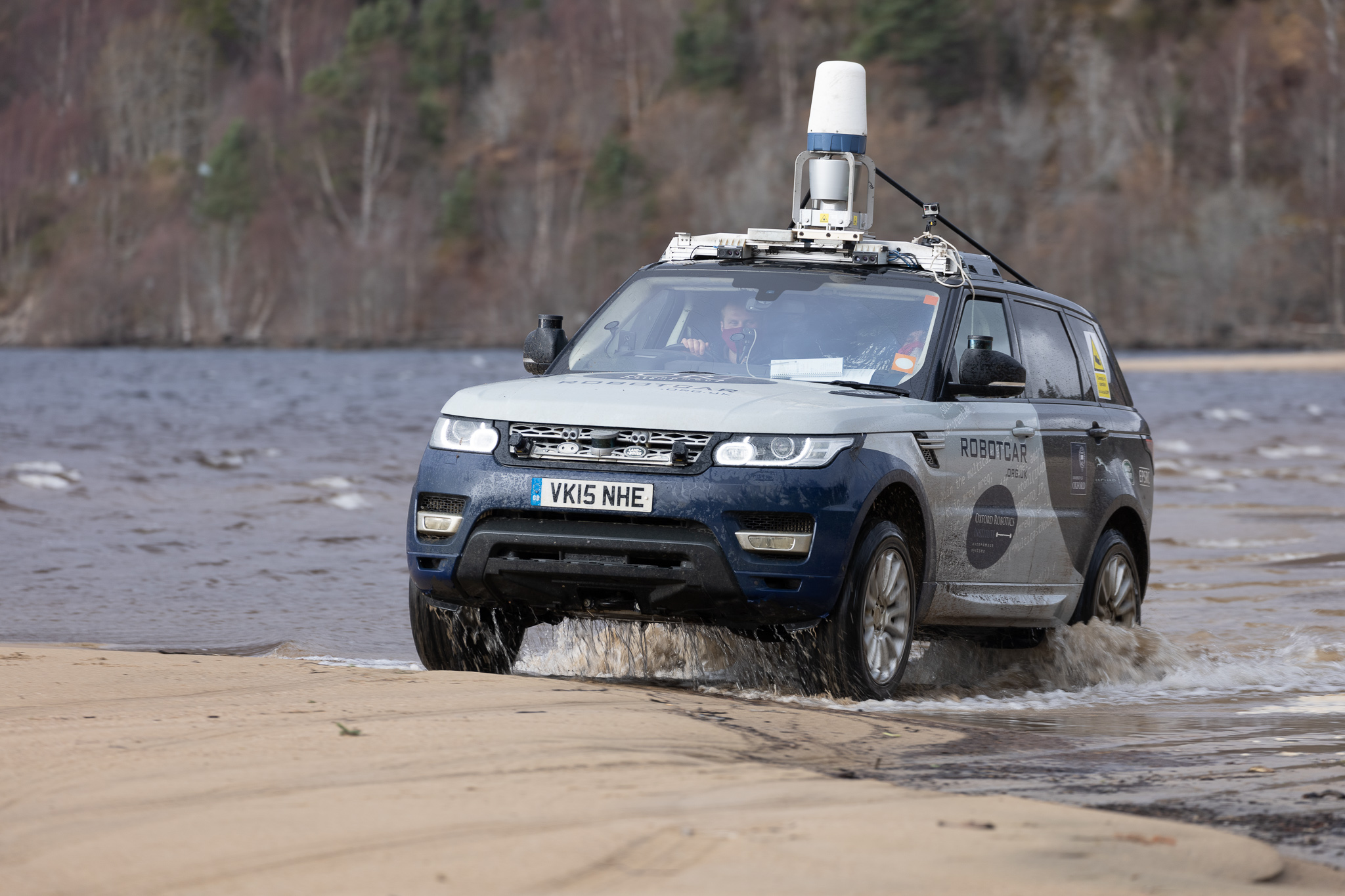 JLR driving through water in scotland. 