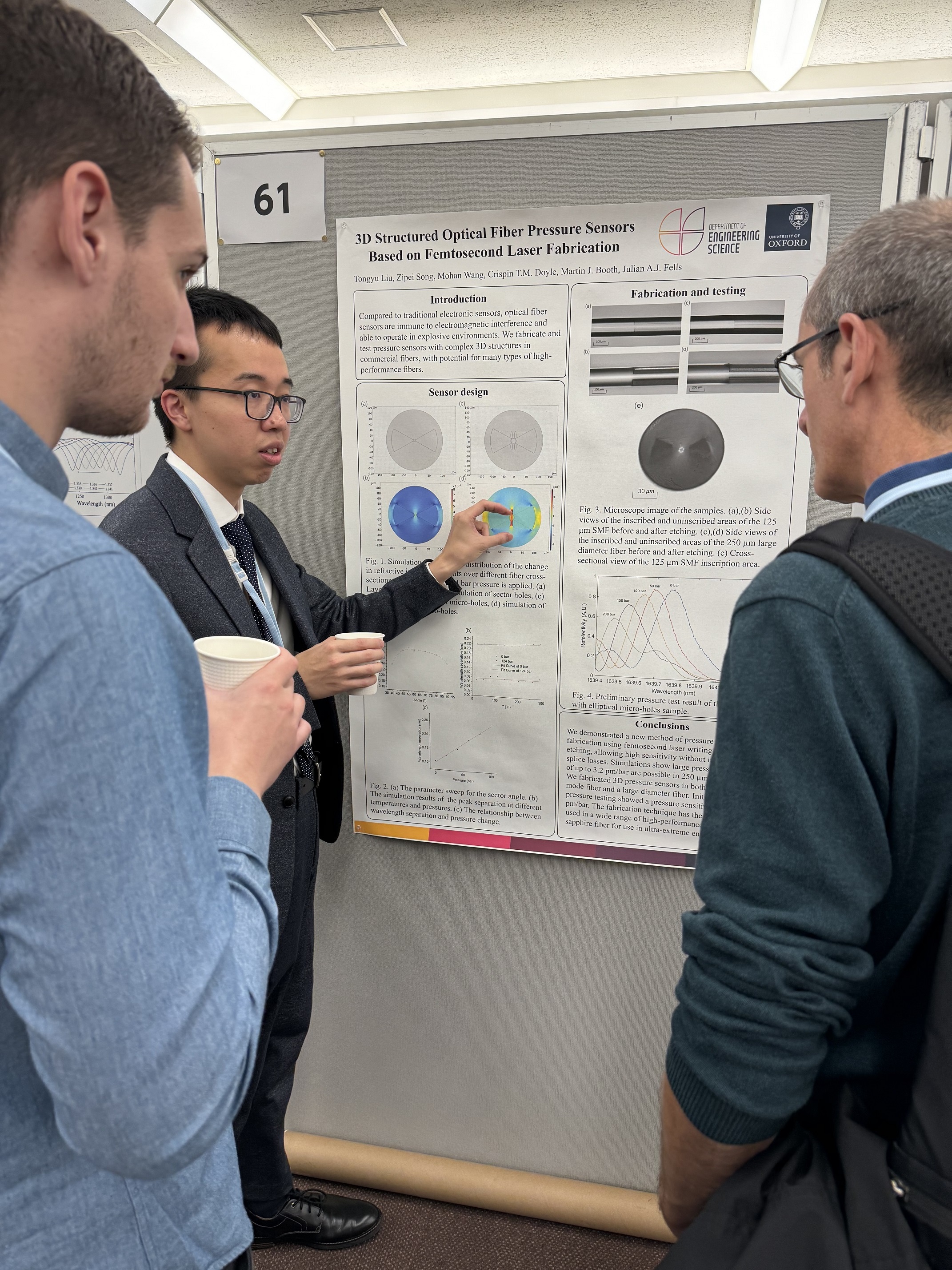 Tongyu Liu - man with East Asian appearance, presenting to two white men.