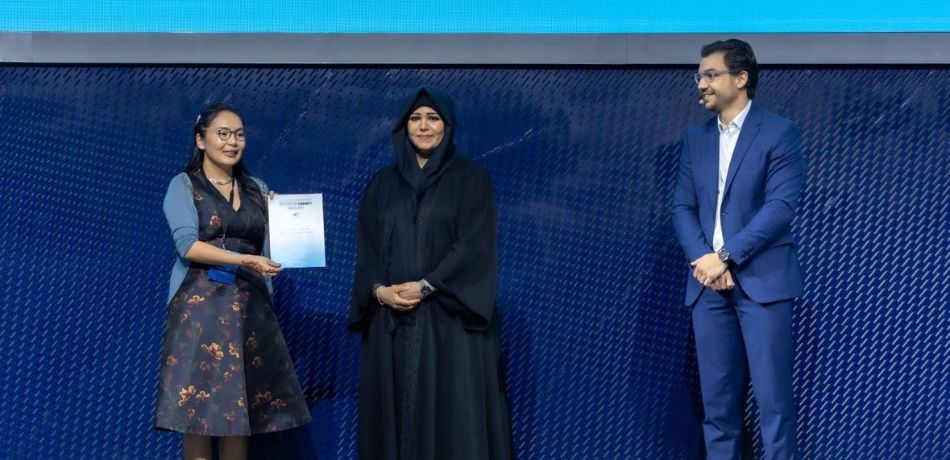 Maral Bayaraa: Maral, on the far left, receives an award on stage from the Dubai hosts, centre and right, at the COP28 Climate change conference.
