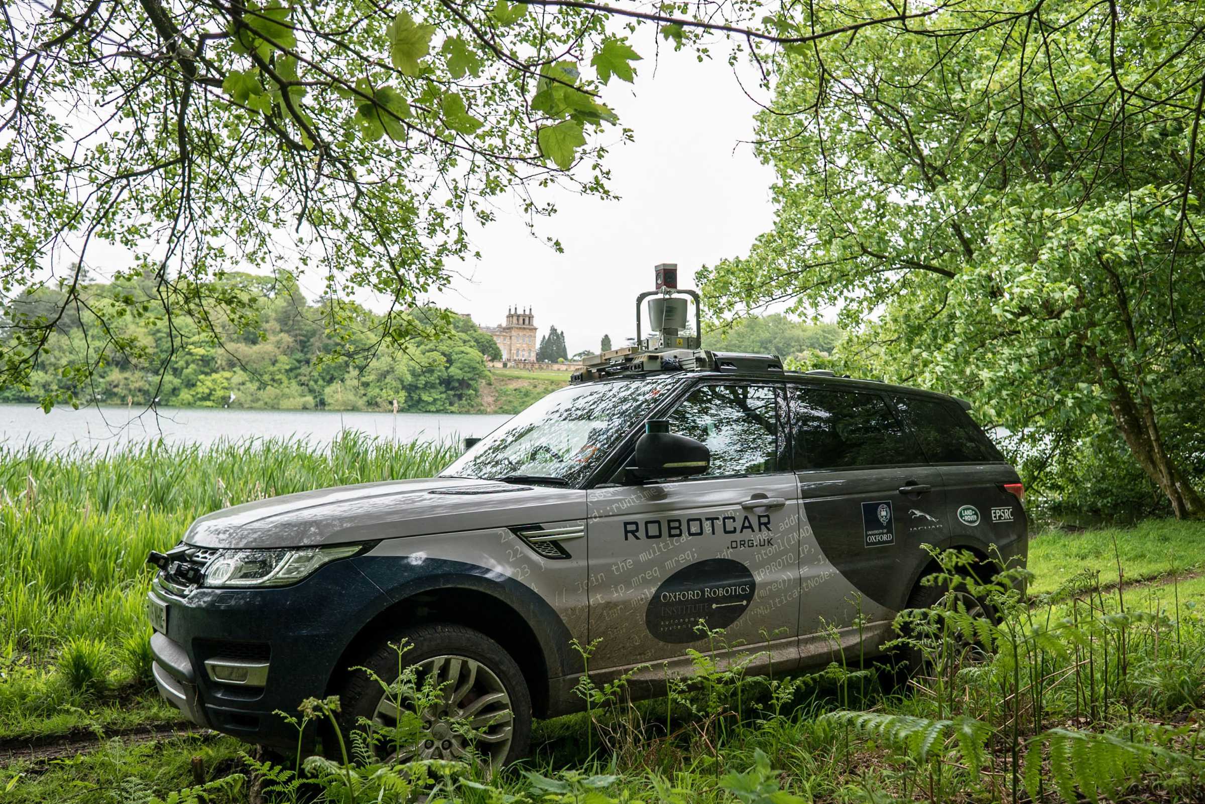 Oxford Robotics Institute vehicle offroad at Blenheim Palace with lake in background