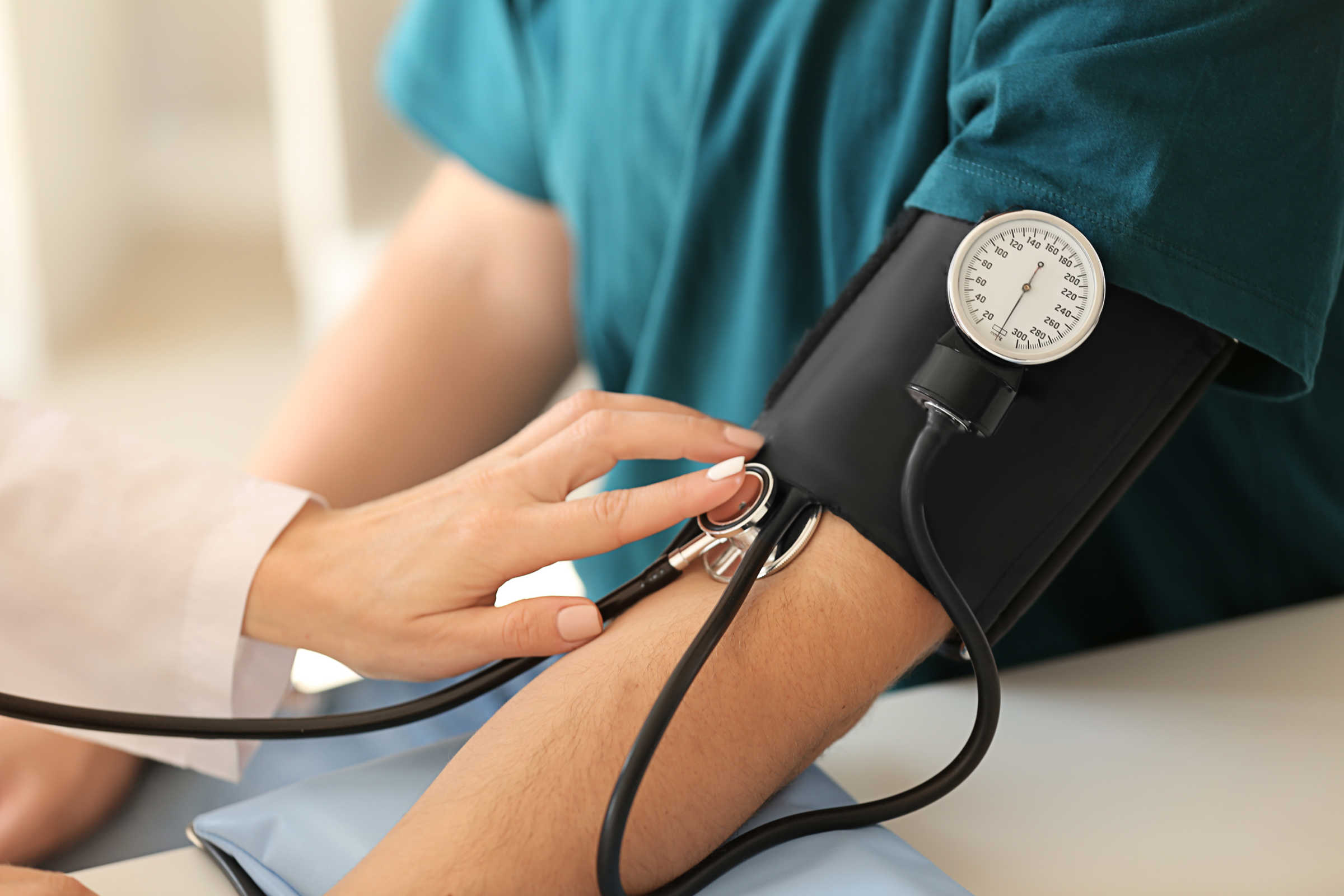 Patient's blood pressure being monitored