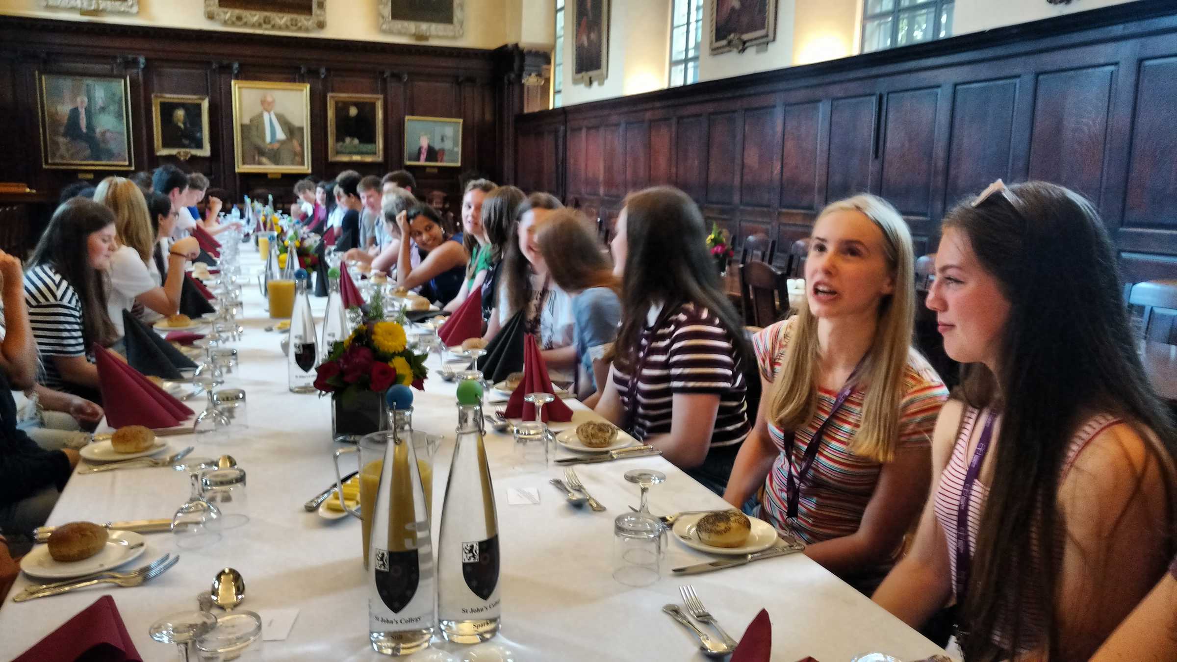 Big group of students at long dining table