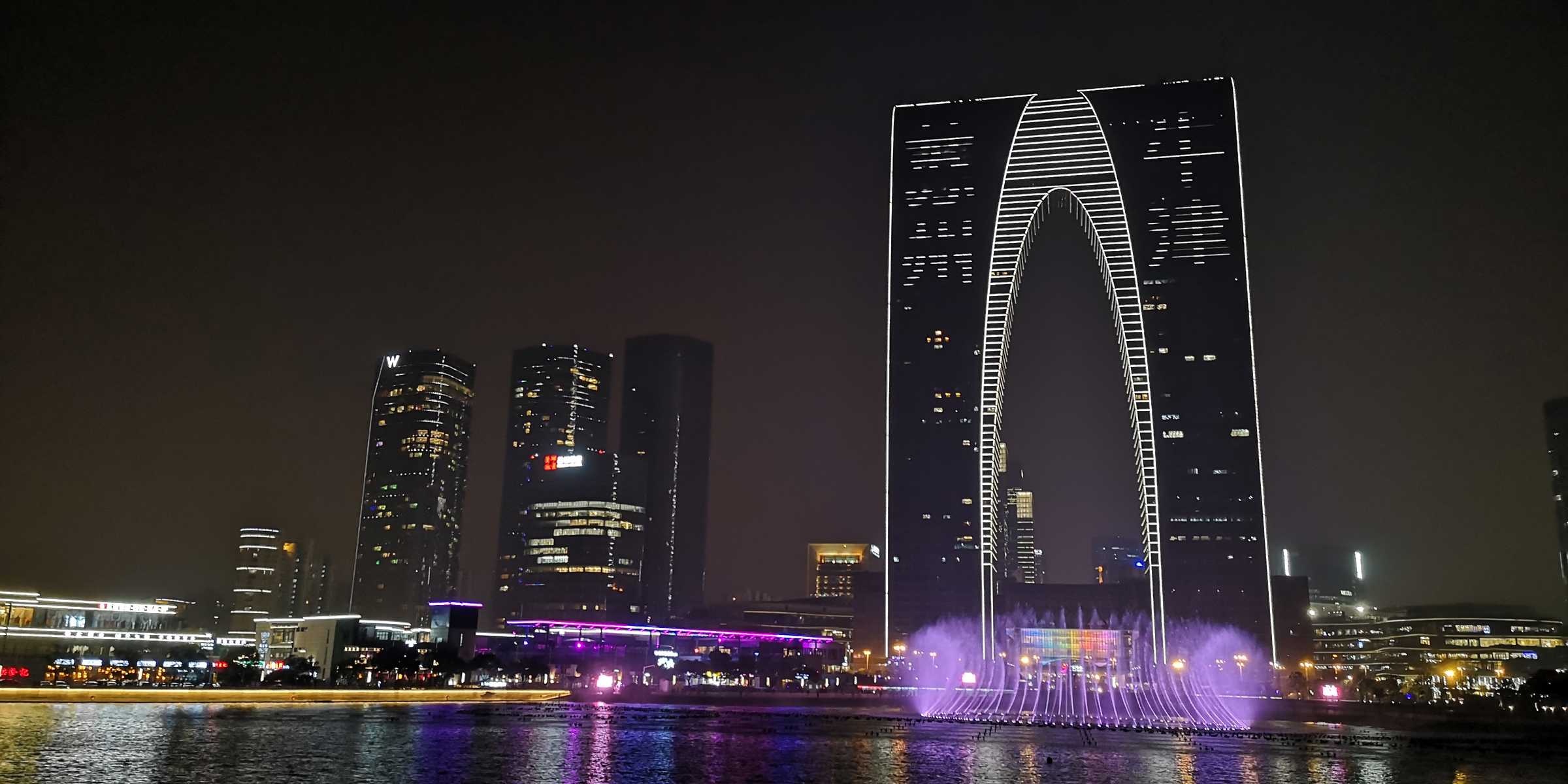 External view of the OSCAR building. Four characters on the skyscraper read 'Suzhou' and 'Niujing', or Oxford