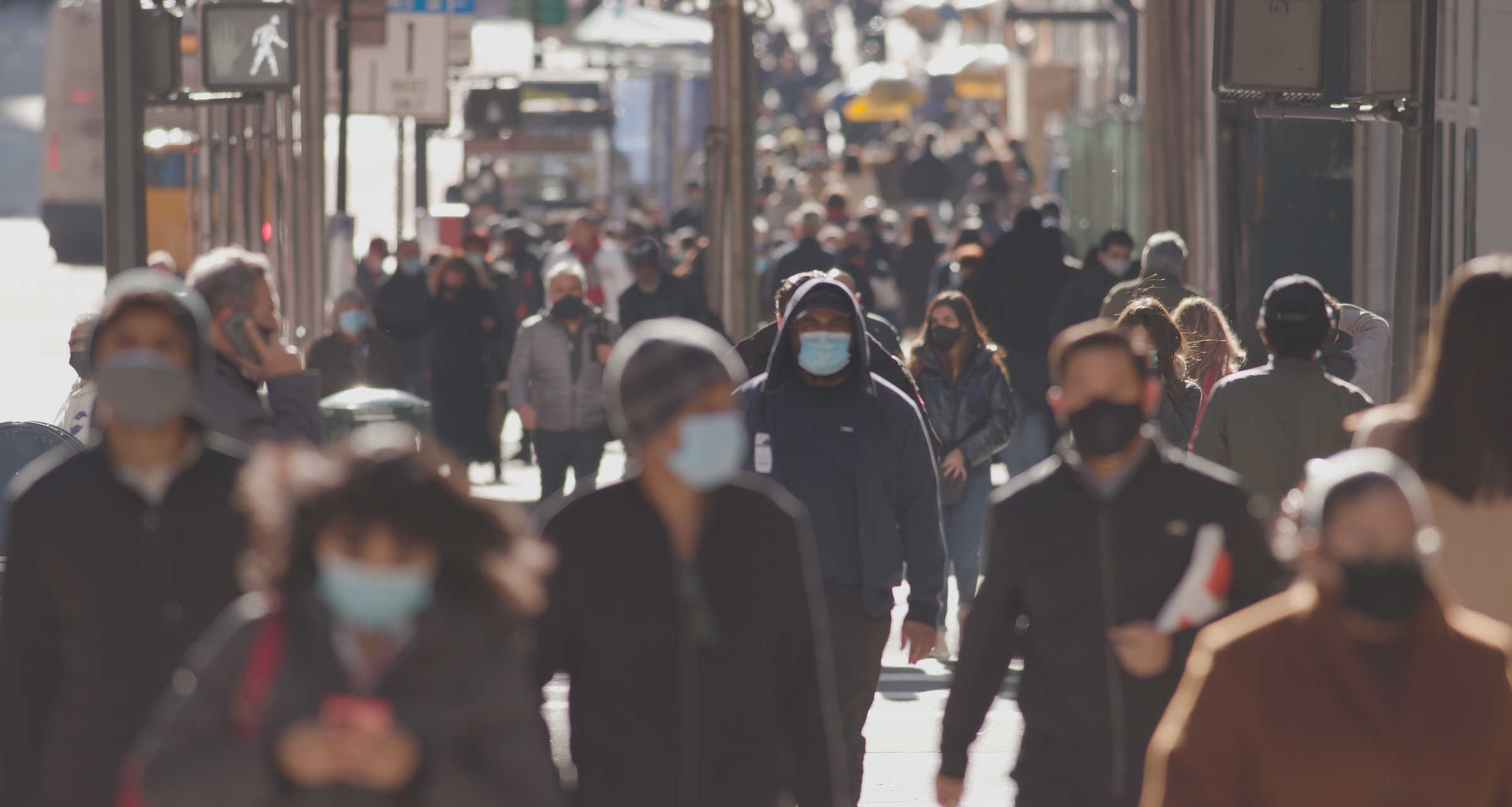 Crowd of people wearing face masks
