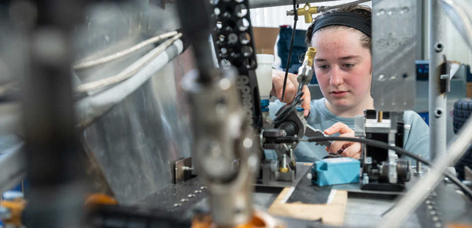 Student working on equipment in the Engineering Science labs