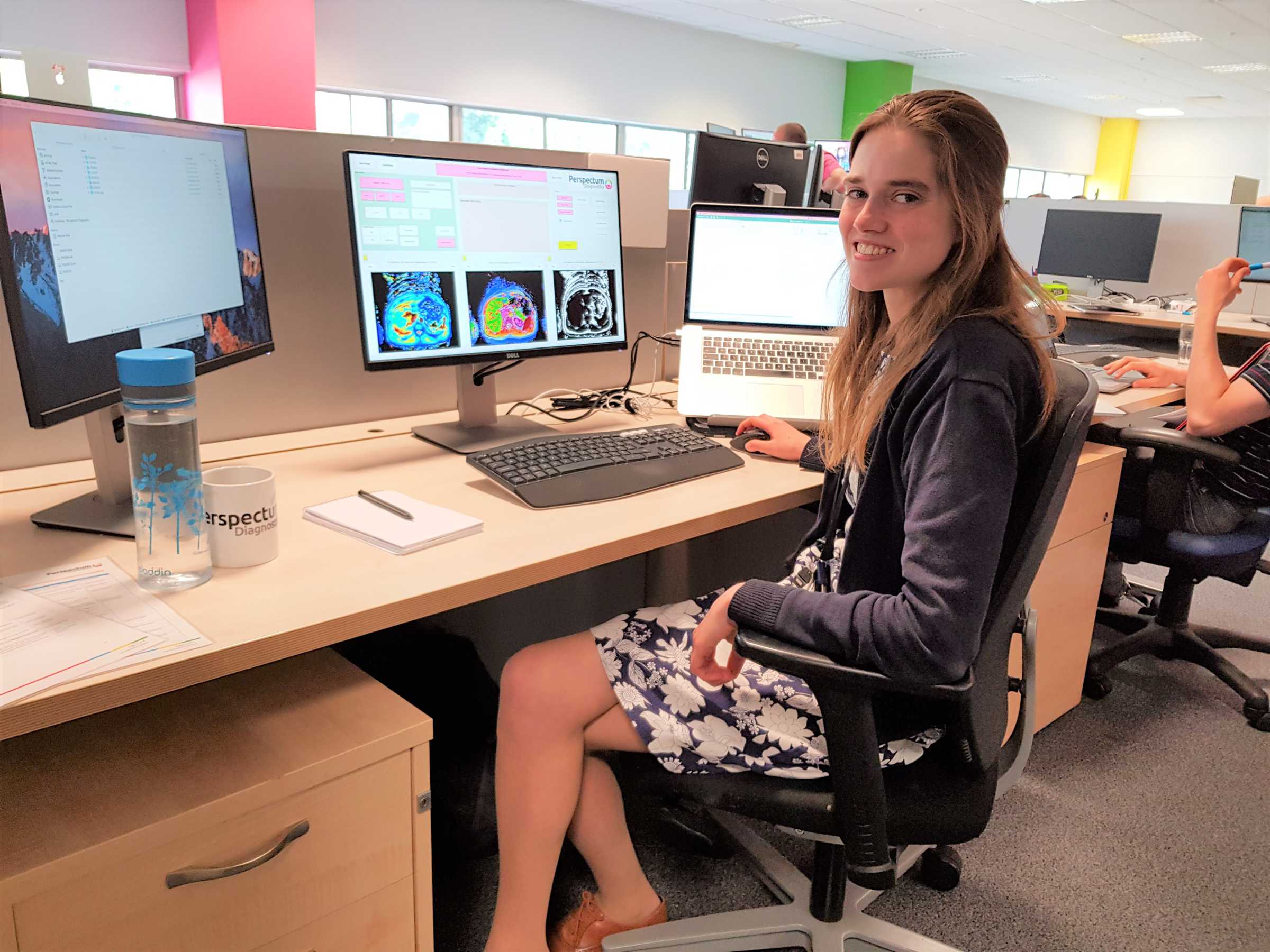 DPhil candidate Elisabeth Pickles at her desk doing research into the use of MRI scanning to monitor disease