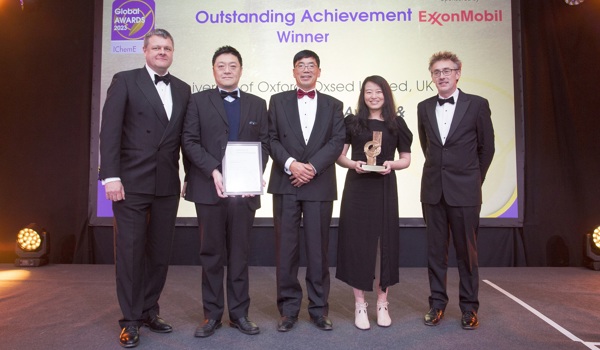 IChemE Awards Outstanding Achievement Winners Oxsed: two white men - far left and far right; two East Asian men - second from left (holding the framed certificate) and centre; one East Asian woman (holding the award statue).