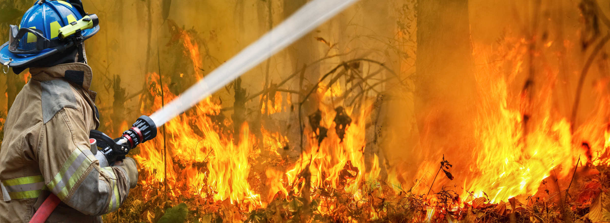 Australian bushfire being contained by firefighter